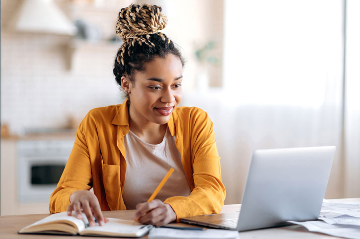 young woman earning business certificate online